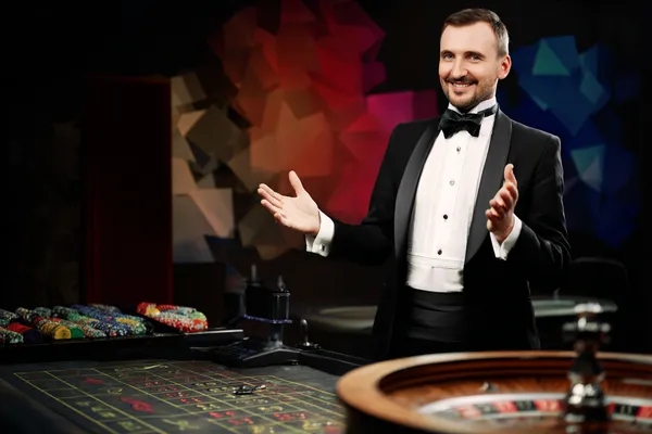 A glowing roulette wheel with cascading chips, symbolizing the engaging live and instant-win games available on 7555BET.